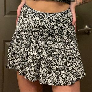 Floral black and white mini pleated tennis skirt